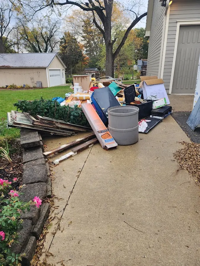 Dumpster being loaded with debris for 3 Yard Dumpster Rental in Stallings